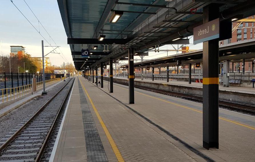 View of platform and rail track at station.